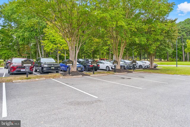 14745 Jennifer Ct, Issue, MD 20645 - uncovered parking lot with view of wooded area