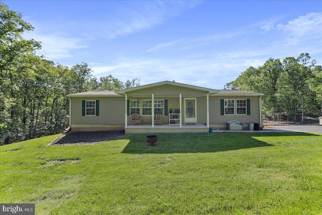 6194 Milo School Rd, Great Cacapon, WV 25422 - rear view of property featuring a yard and a porch