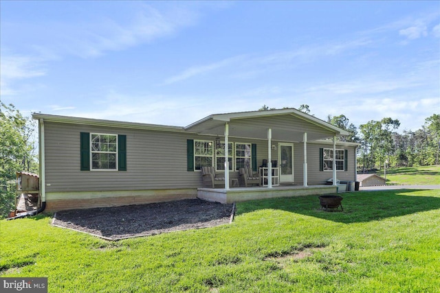6194 Milo School Rd, Great Cacapon, WV 25422 - rear view of house with a lawn and covered porch