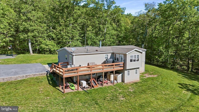 6194 Milo School Rd, Great Cacapon, WV 25422 - rear view of house with a deck, a yard, and a forest view