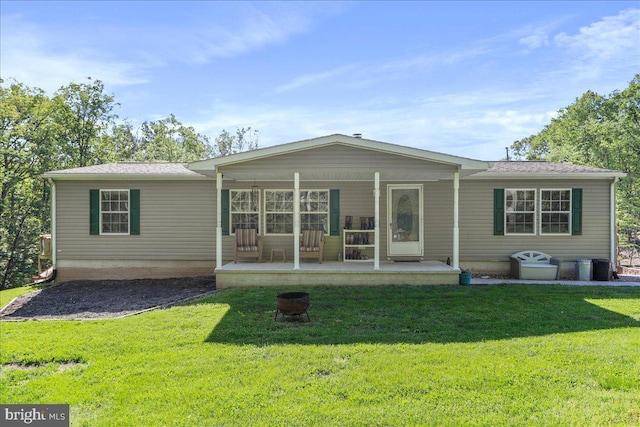 6194 Milo School Rd, Great Cacapon, WV 25422 - rear view of house with covered porch and a lawn
