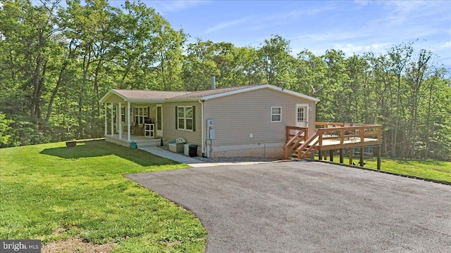 6194 Milo School Rd, Great Cacapon, WV 25422 - view of front of property featuring a front lawn, crawl space, a porch, and a deck
