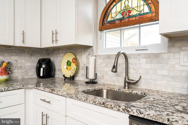 104 Lake View Ct, Columbus, NJ 08022 - kitchen featuring a sink, white cabinets, and decorative backsplash
