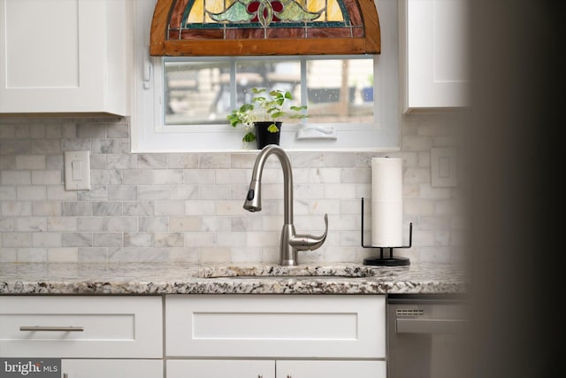104 Lake View Ct, Columbus, NJ 08022 - kitchen view of a sink, stainless steel dishwasher, white cabinetry, and decorative backsplash