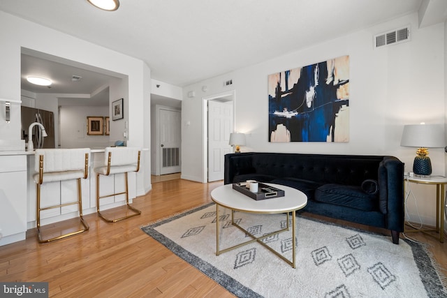 1045 N Utah St Unit 2-304, Arlington, VA 22201 - living room with light wood-style flooring and baseboards
