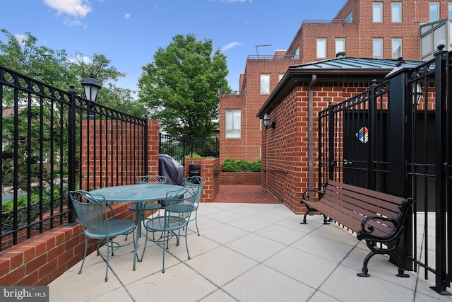 1045 N Utah St Unit 2-304, Arlington, VA 22201 - view of patio featuring fence and outdoor dining space