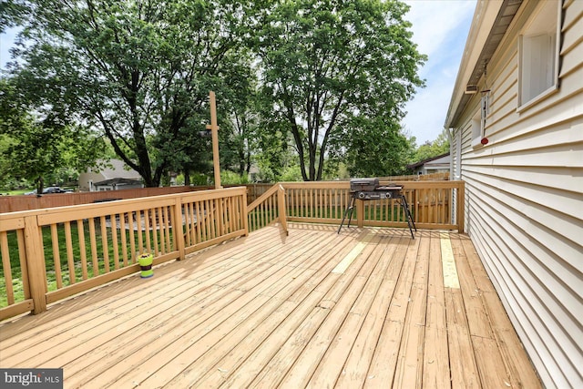 wooden deck featuring fence