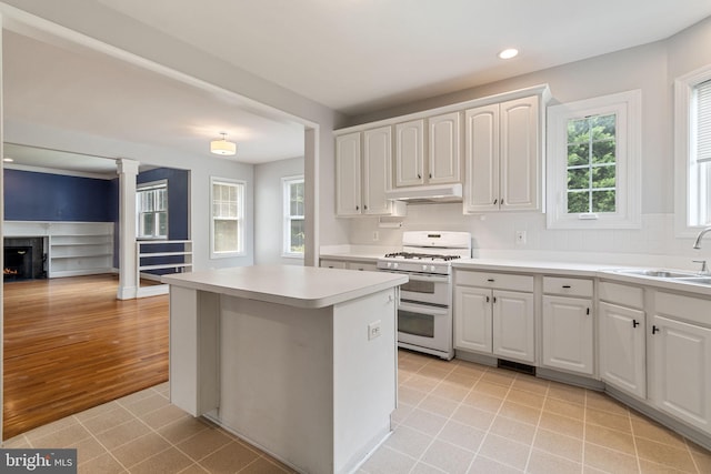600 Grace St, Herndon, VA 20170 - kitchen featuring range with two ovens, under cabinet range hood, a sink, recessed lighting, and white cabinets