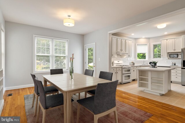 600 Grace St, Herndon, VA 20170 - dining space with light wood finished floors, recessed lighting, and baseboards