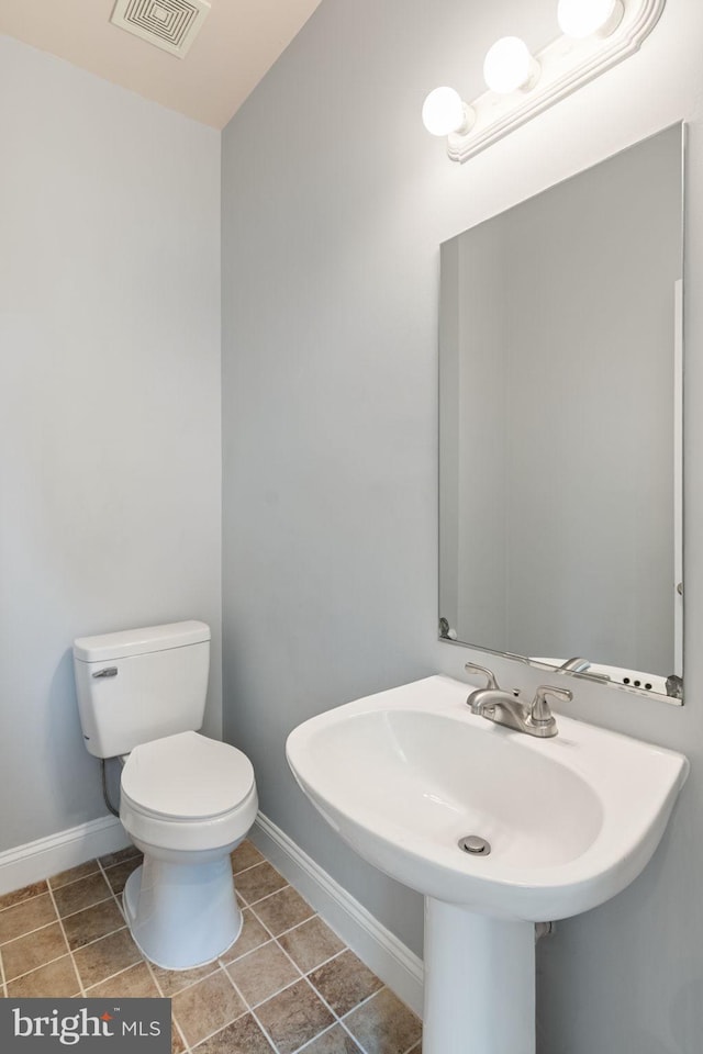 600 Grace St, Herndon, VA 20170 - bathroom featuring toilet, baseboards, and tile patterned flooring