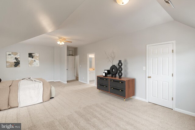 600 Grace St, Herndon, VA 20170 - bedroom with light colored carpet, baseboards, ensuite bathroom, and vaulted ceiling