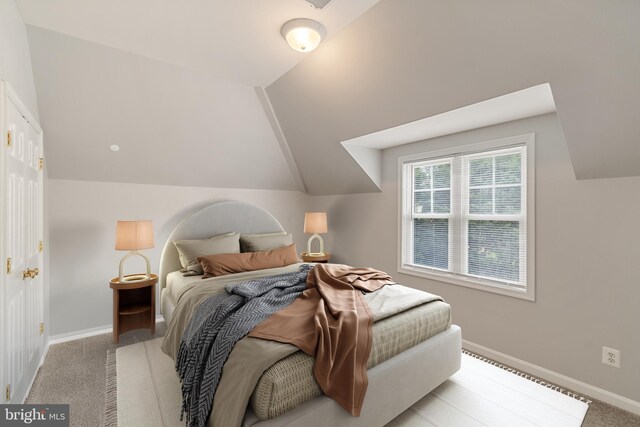 600 Grace St, Herndon, VA 20170 - bedroom featuring lofted ceiling, baseboards, and light colored carpet