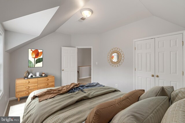 600 Grace St, Herndon, VA 20170 - bedroom featuring vaulted ceiling, carpet floors, a closet, and baseboards