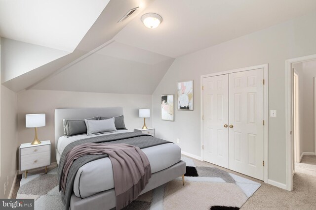 600 Grace St, Herndon, VA 20170 - carpeted bedroom featuring a closet, baseboards, and vaulted ceiling