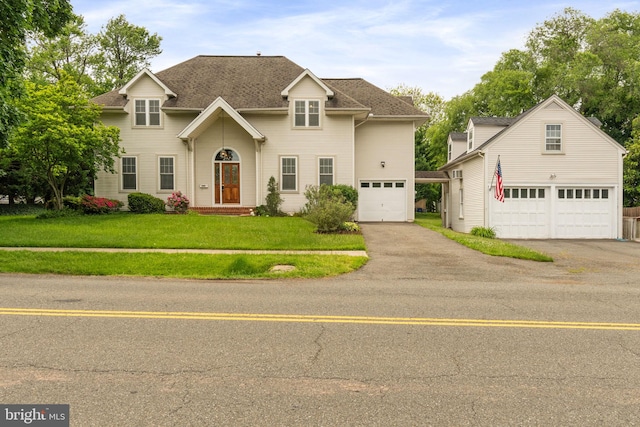 600 Grace St, Herndon, VA 20170 - traditional-style house featuring a garage, a front lawn, and asphalt driveway