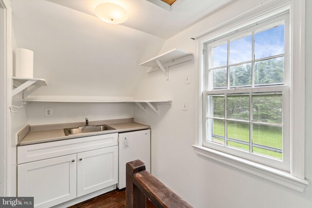 600 Grace St, Herndon, VA 20170 - clothes washing area featuring a sink and dark wood-type flooring