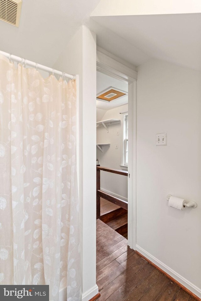 600 Grace St, Herndon, VA 20170 - full bath featuring hardwood / wood-style floors, baseboards, and a shower with curtain