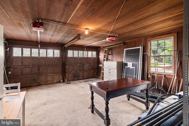 600 Grace St, Herndon, VA 20170 - garage featuring a garage door opener, wood walls, and wooden ceiling