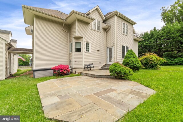 600 Grace St, Herndon, VA 20170 - back of property featuring a yard, a patio, and entry steps