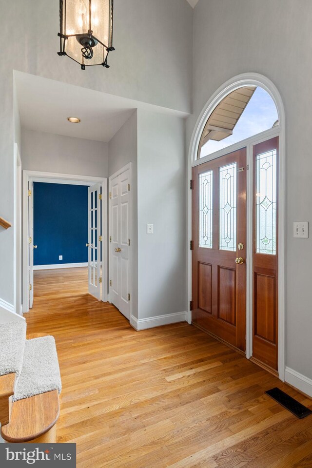 600 Grace St, Herndon, VA 20170 - foyer with light wood-style floors, baseboards, and a high ceiling