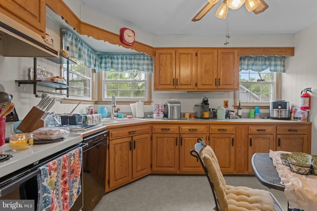 kitchen featuring a sink, black dishwasher, light countertops, and brown cabinetry
