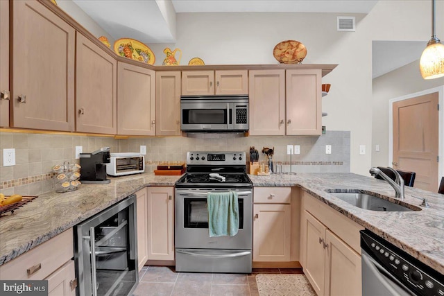 320 Hummingbird Way Unit 302, Lake Harmony, PA 18624 - kitchen with appliances with stainless steel finishes, wine cooler, a sink, tasteful backsplash, and light brown cabinets