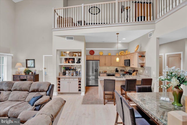 320 Hummingbird Way Unit 302, Lake Harmony, PA 18624 - living area featuring a towering ceiling and light wood-style floors