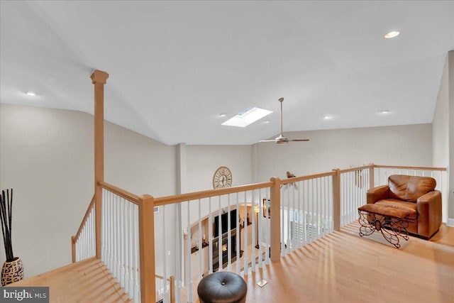320 Hummingbird Way Unit 302, Lake Harmony, PA 18624 - hall with lofted ceiling, a skylight, wood finished floors, and recessed lighting