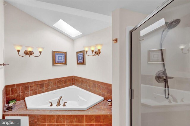 320 Hummingbird Way Unit 302, Lake Harmony, PA 18624 - bathroom featuring a skylight, a shower stall, a bath, and lofted ceiling