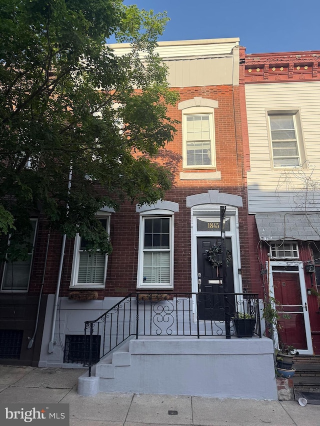 multi unit property featuring brick siding