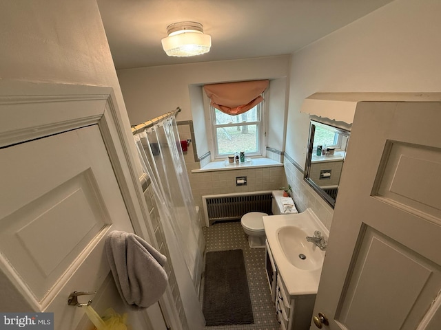 bathroom featuring radiator, tile patterned floors, toilet, tile walls, and a shower with shower curtain