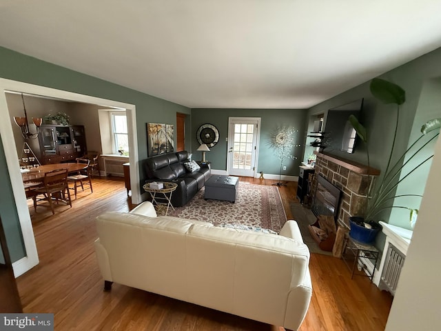 living area featuring wood finished floors and healthy amount of natural light