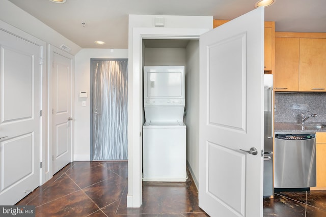 916 G St NW Unit 505, Washington, DC 20001 - laundry area featuring stacked washing machine and dryer and recessed lighting