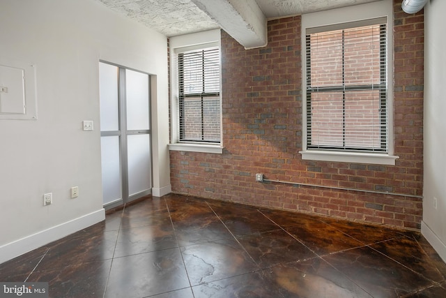 916 G St NW Unit 505, Washington, DC 20001 - empty room featuring brick wall and electric panel