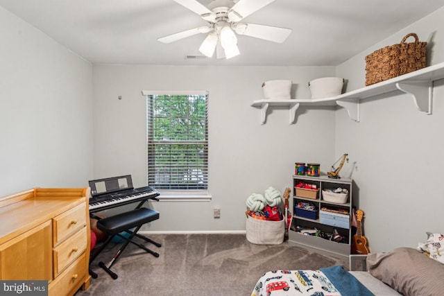 office space with carpet flooring, a ceiling fan, and baseboards