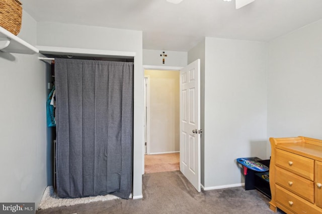 bedroom with carpet and baseboards