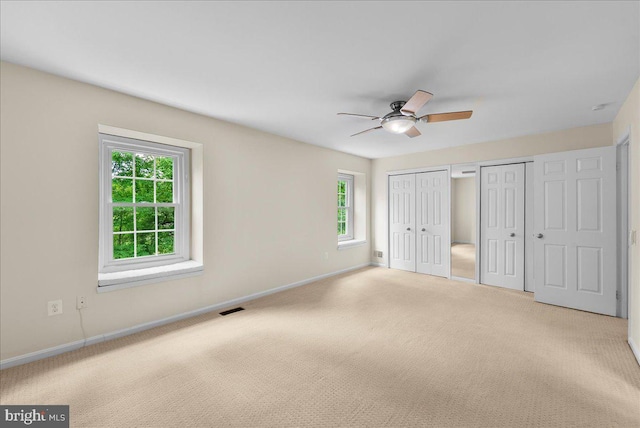 4516 4th Rd N, Arlington, VA 22203 - unfurnished bedroom with two closets, baseboards, carpet flooring, and a ceiling fan