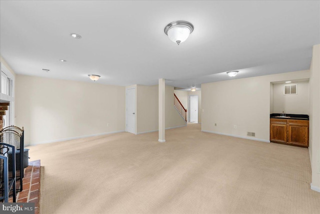 4516 4th Rd N, Arlington, VA 22203 - unfurnished living room featuring stairway, a sink, light colored carpet, and baseboards