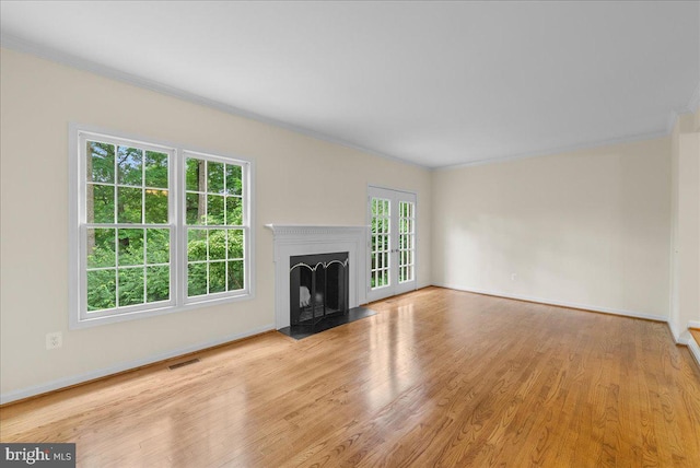 4516 4th Rd N, Arlington, VA 22203 - unfurnished living room featuring crown molding, wood finished floors, a fireplace with flush hearth, and baseboards