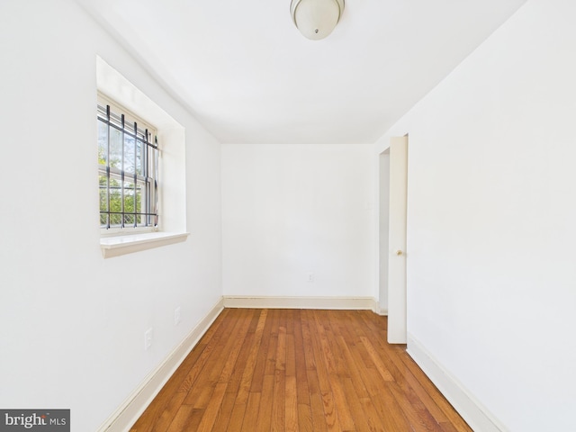 4712 Woodland Ave, Philadelphia, PA 19143 - unfurnished room with wood finished floors and baseboards