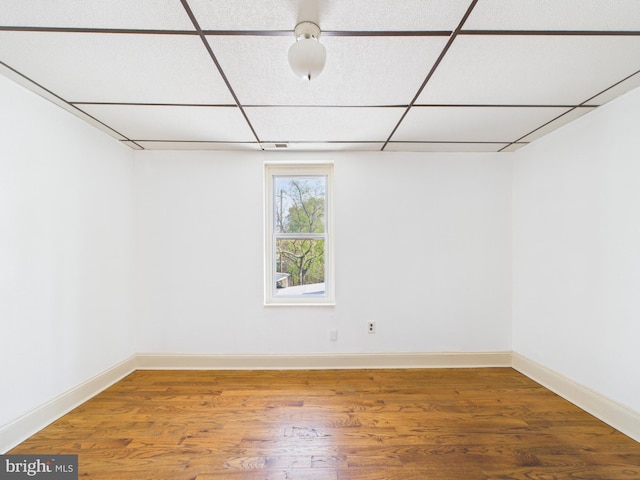 4712 Woodland Ave, Philadelphia, PA 19143 - below grade area with a paneled ceiling, wood finished floors, and baseboards