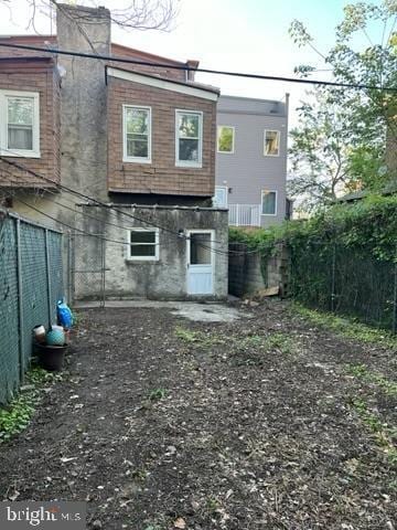 4712 Woodland Ave, Philadelphia, PA 19143 - back of property with fence and a chimney
