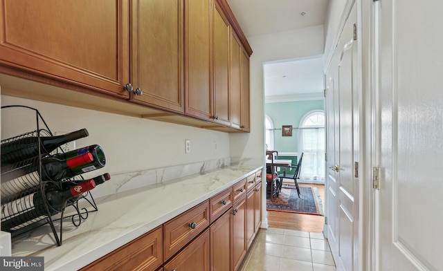 2714 Cabernet Ln, Annapolis, MD 21401 - bar area with ornamental molding and light tile patterned floors