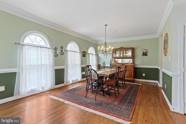 2714 Cabernet Ln, Annapolis, MD 21401 - dining room featuring wood finished floors, a chandelier, ornamental molding, and baseboards