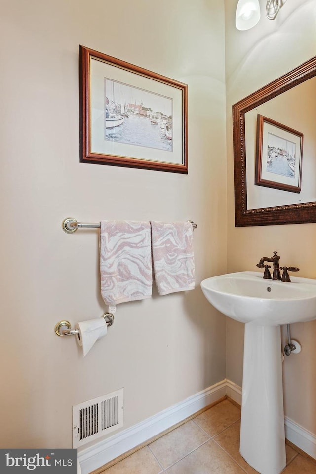 2714 Cabernet Ln, Annapolis, MD 21401 - bathroom featuring tile patterned floors, baseboards, and a sink