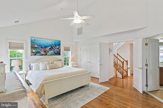 2714 Cabernet Ln, Annapolis, MD 21401 - bedroom featuring light wood-style flooring, high vaulted ceiling, a ceiling fan, and a closet