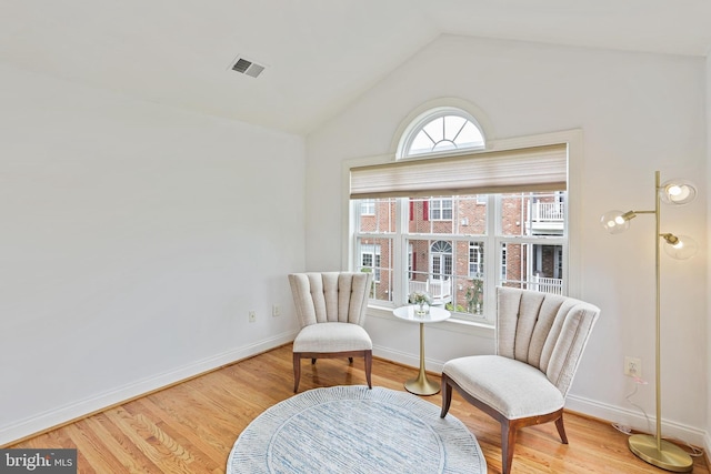 2714 Cabernet Ln, Annapolis, MD 21401 - living area with wood finished floors, vaulted ceiling, and baseboards
