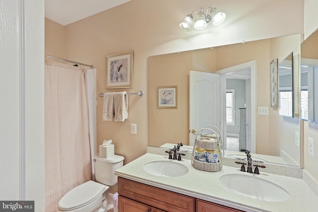 2714 Cabernet Ln, Annapolis, MD 21401 - bathroom featuring double vanity, toilet, and curtained shower