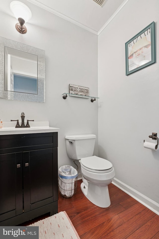 1415 Aspen Ct, West Chester, PA 19380 - half bathroom with wood finished floors, crown molding, baseboards, toilet, and vanity