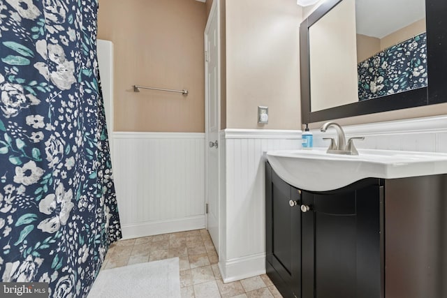 1415 Aspen Ct, West Chester, PA 19380 - full bath with a wainscoted wall, vanity, curtained shower, and baseboards